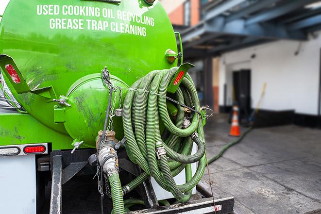 grease trap pumping truck with hose in Belgium, WI